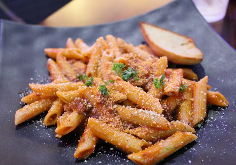 Spicy arrabbiata penne pasta with fresh herbs
